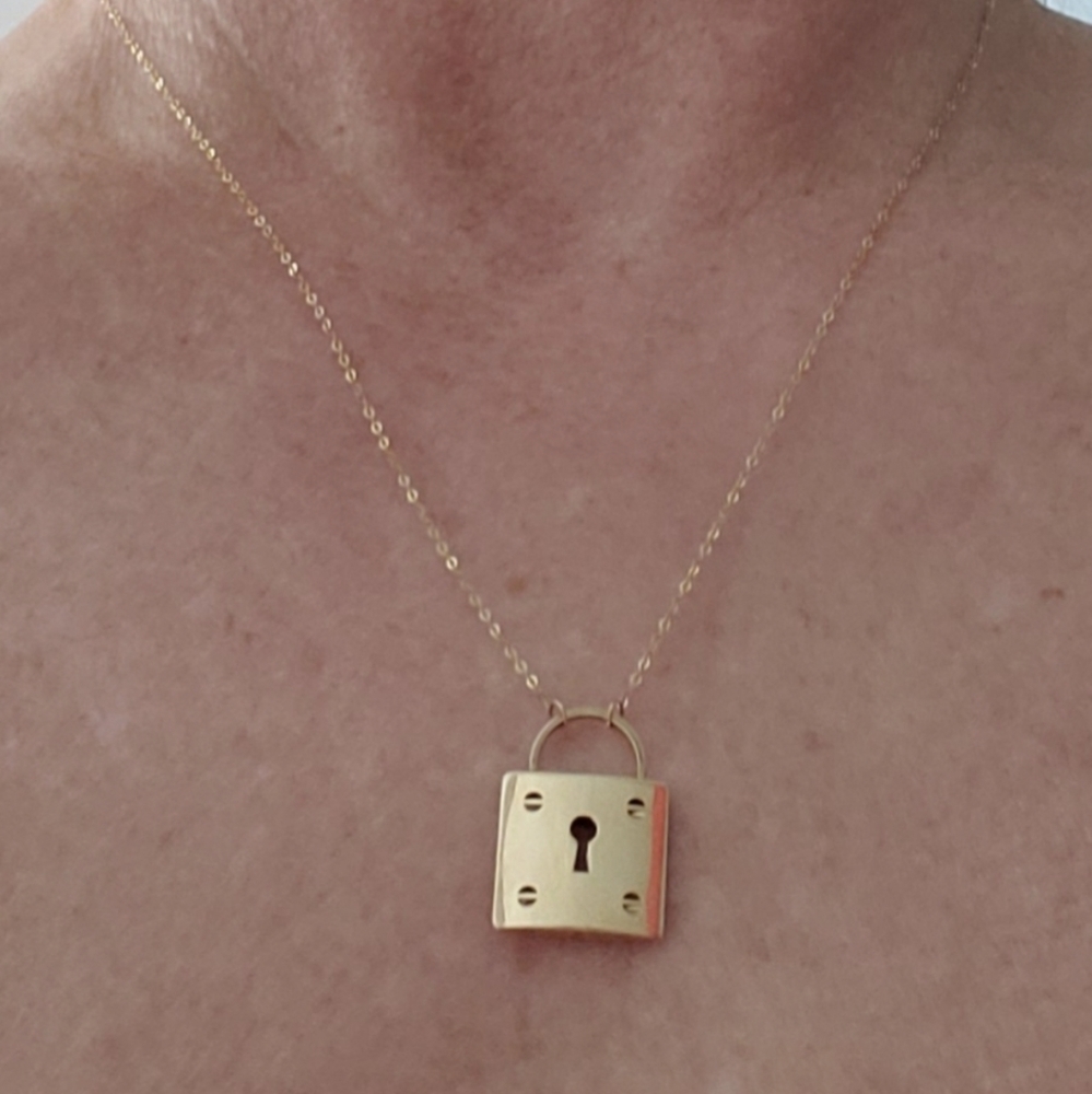 Genuine 14kt yellow gold locket necklace with 14kt adjustable chain.
